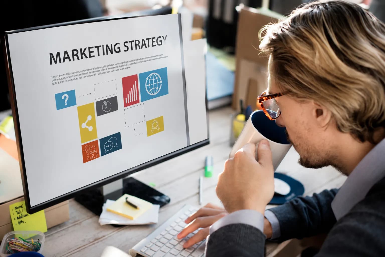 Digital marketing company expert analyzing marketing strategy on desktop monitor