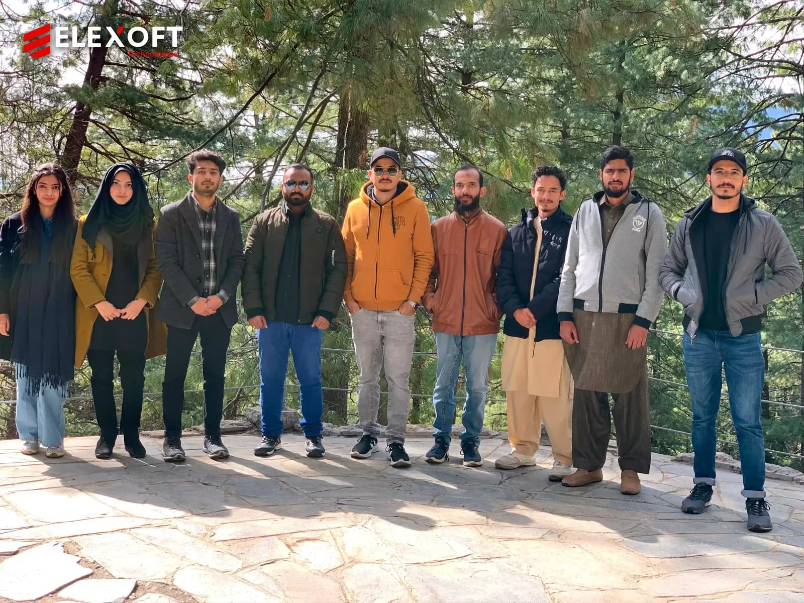 Custom software development services team enjoying mountain scenery