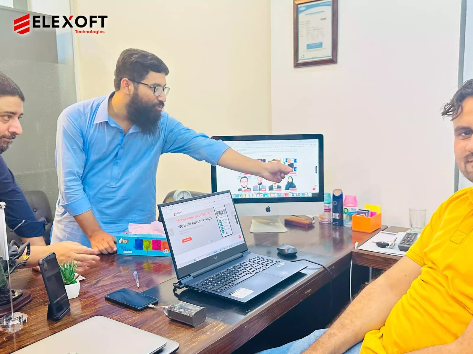 Custom technology solutions team reviewing digital projects