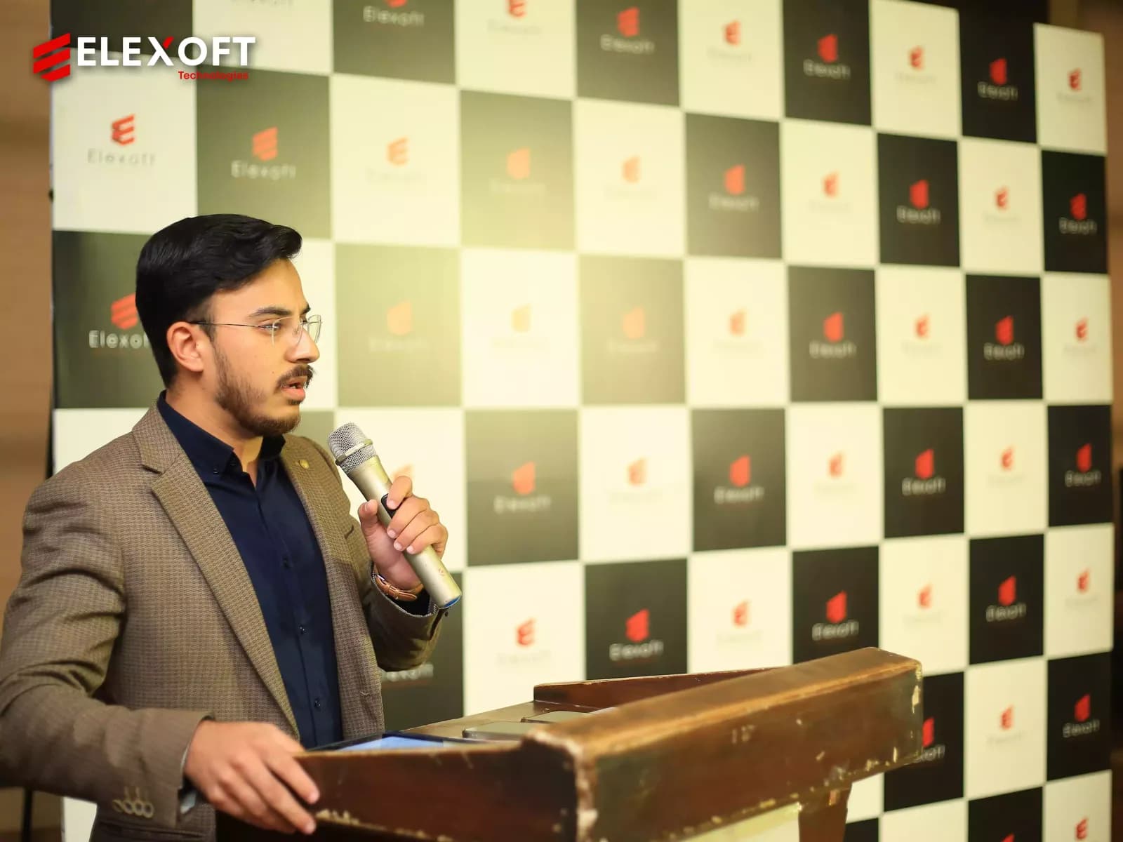 Technology consulting services team member addressing the awards gathering